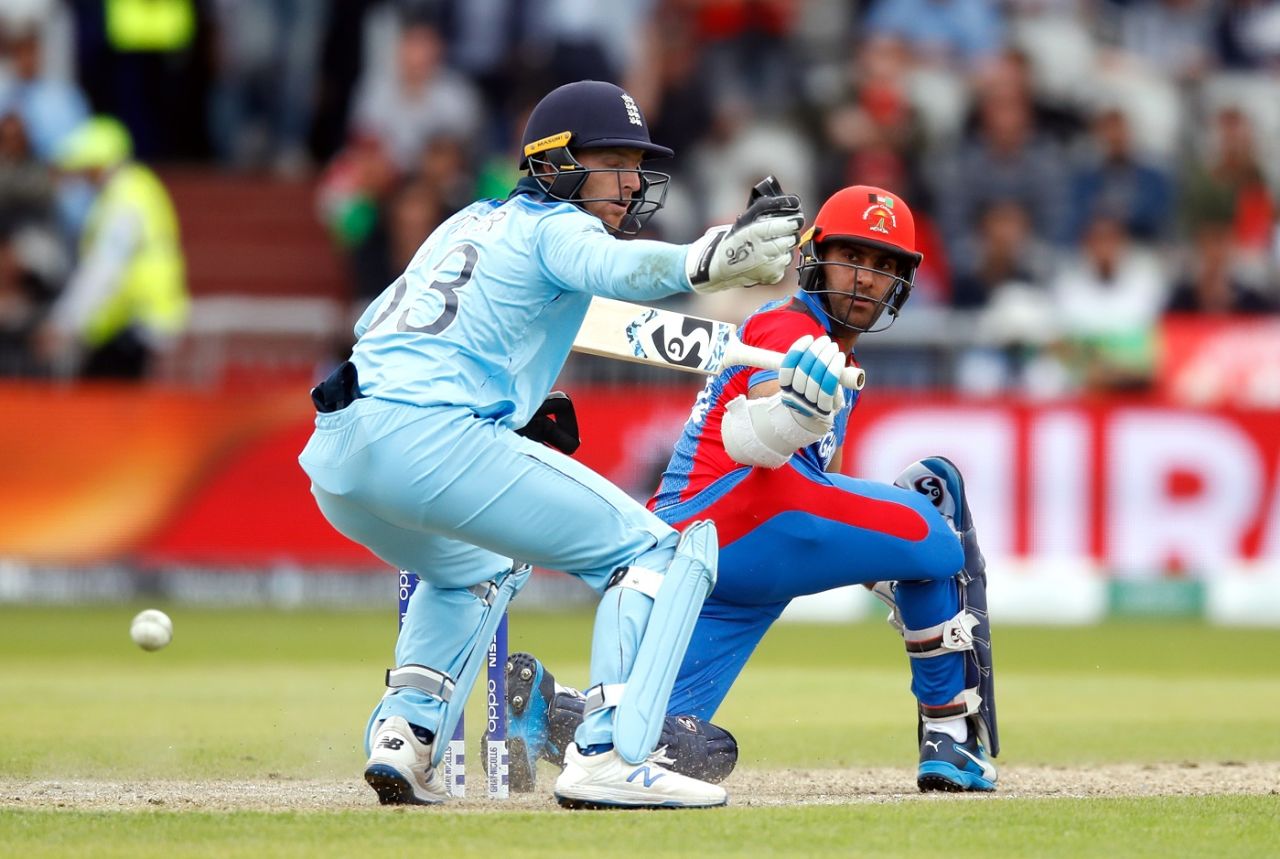 Hashmatullah Shahidi hits the ball past Jos Buttler, England v Afghanistan, World Cup 2019, Manchester, June 18, 2019