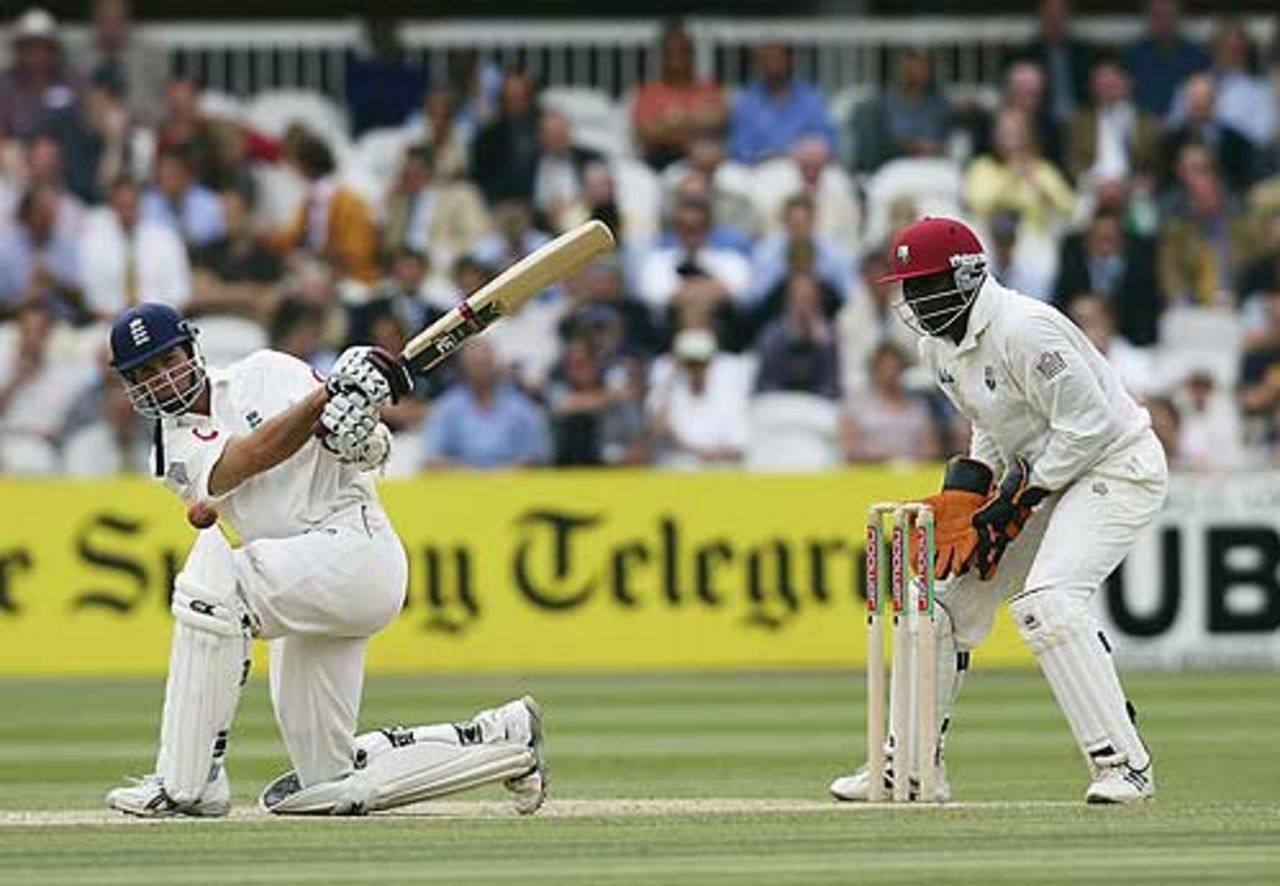 Michael Vaughan sweeps during his second hundred of the match, England v West Indies, 1st Test, July 25 2004