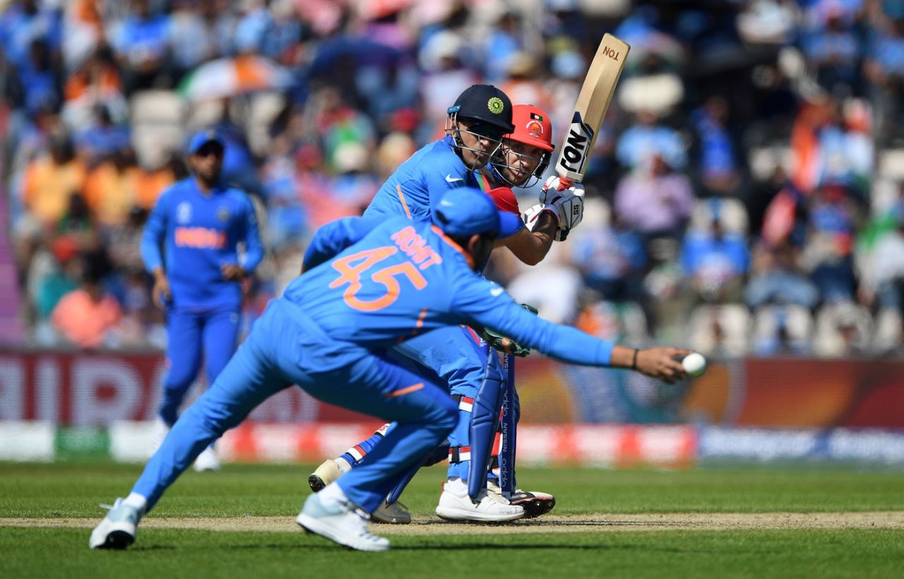 MS Dhoni looks on as Rohit Sharma just fails to reach a shot by Rahmat Shah, Afghanistan v India, World Cup 2019, Southampton, June 22, 2019
