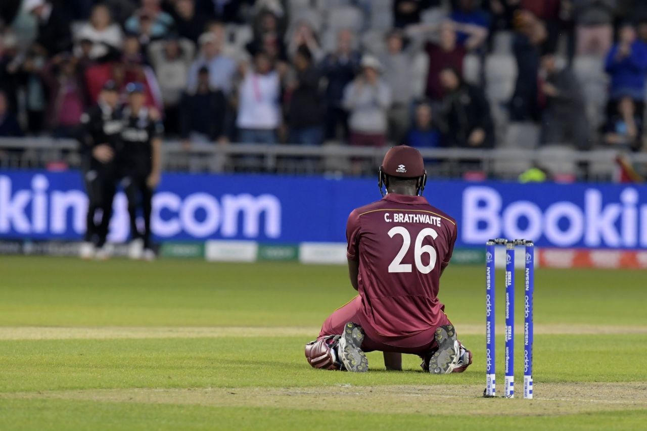 Carlos Brathwaite sinks to his knees after getting caught on the boundary, New Zealand v West Indies, World Cup 2019, Manchester, June 22, 2019