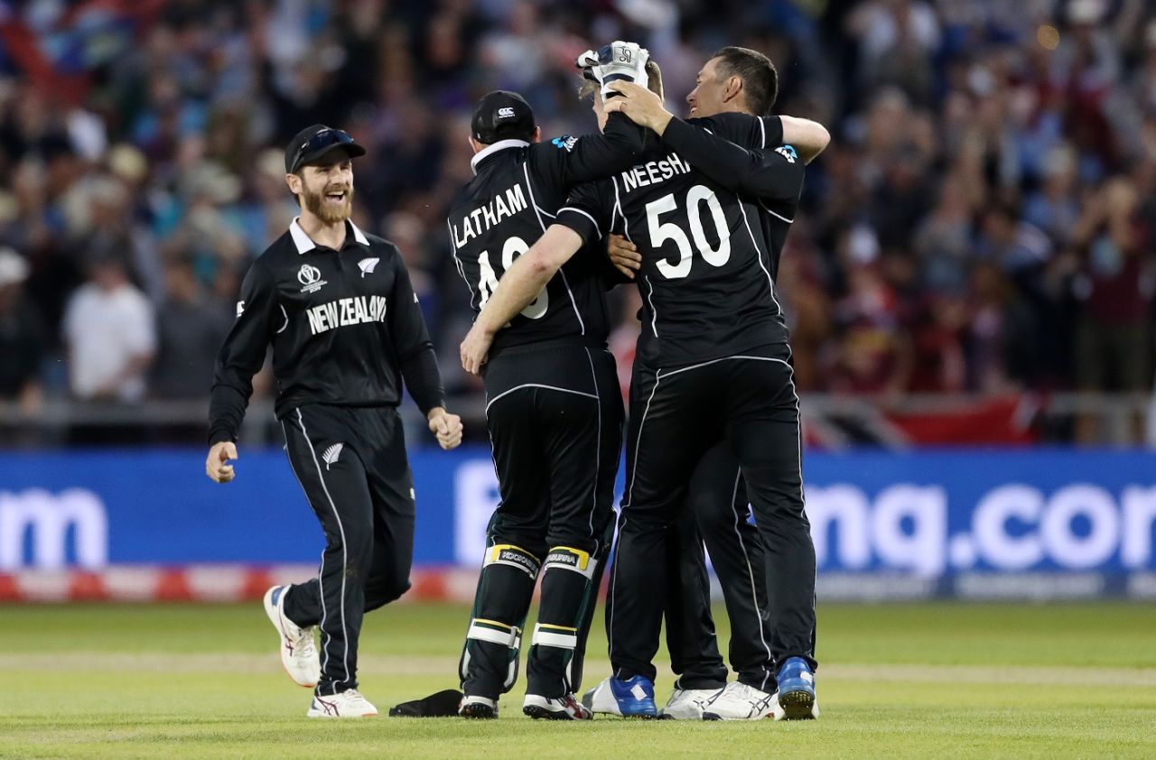 Jimmy Neesham is mobbed his teammates after taking Carlos Brathwaite's wicket to end the West Indies innings, New Zealand v West Indies, World Cup 2019, Manchester, June 22, 2019
