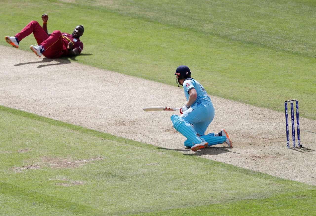 Andre Russell falls over after delivering a ball