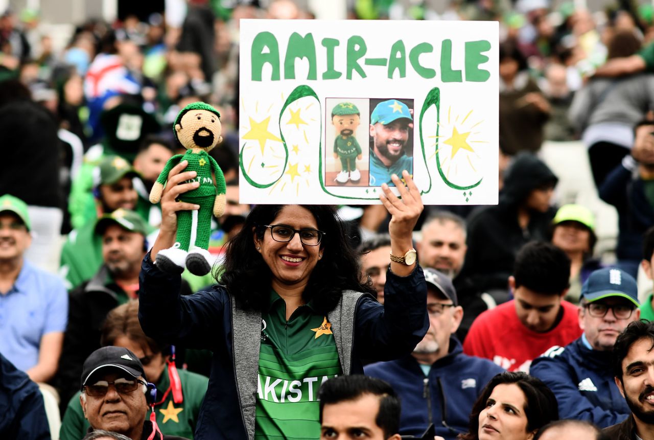 A fan holds up a Mohammad Amir poster and doll, New Zealand v Pakistan, World Cup 2019, Birmingham, June 26, 2019