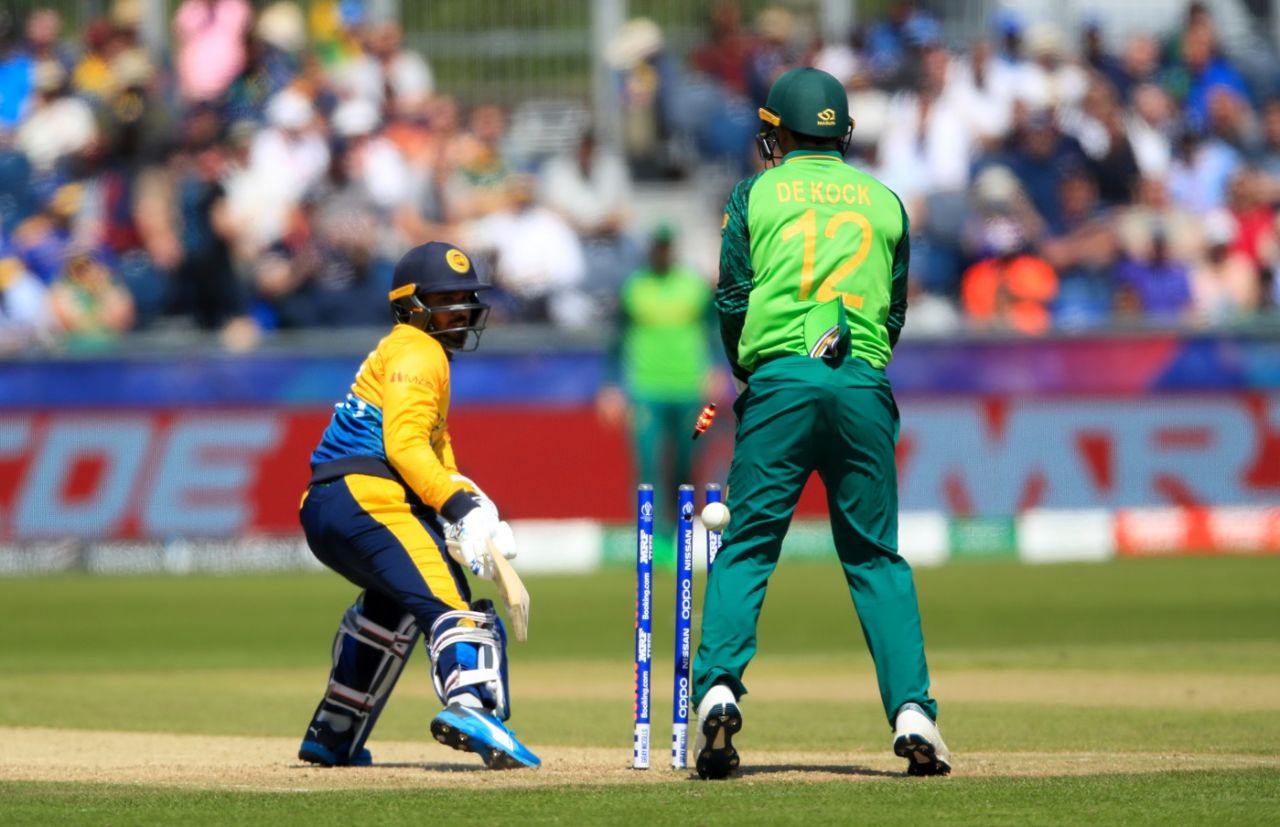Dhanajaya de Silva looks back to see his bails fly after missing with a reverse sweep off JP Duminy, South Africa v Sri Lanka, World Cup 2019, Chester-le-Street, June 28, 2019