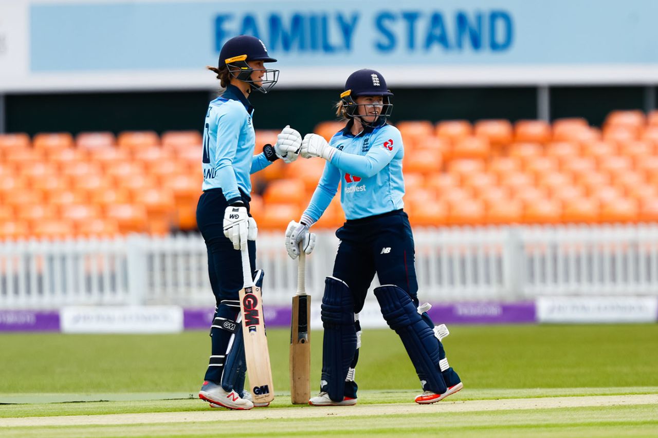 England openers Amy Jones and Tammy Beaumont celebrate a boundary by Beaumont, England Women v West Indies Women, 1st ODI, Leicester, June 6, 2019