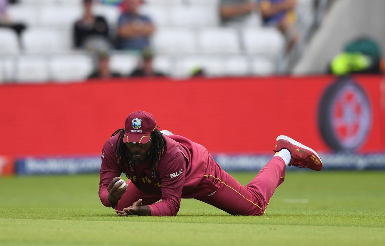 Chris Gayle dives forward to dismiss Rahmat Shah, Afghanistan v West Indies. World Cup 2019, Headingley, July 4, 2019