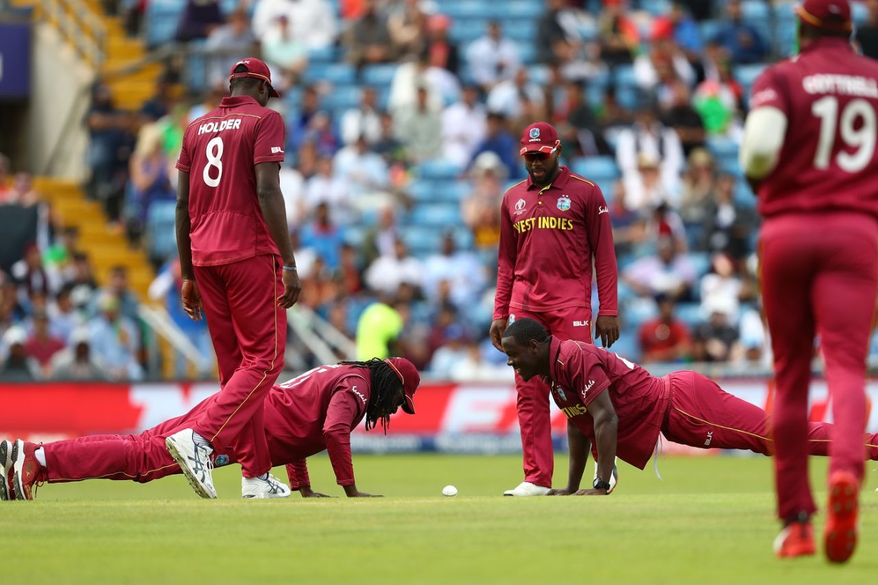 Chris Gayle and Carlos Bratwaite do push-ups to celebrate Rahmat Shah's wicket, Afghanistan v West Indies. World Cup 2019, Headingley, July 4, 2019