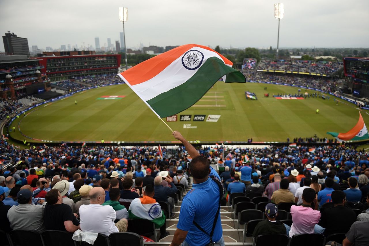 An Indian fan waves his national flag as the two teams come out for the anthems, India v New Zealand, World Cup 2019, Old Trafford, July 9, 2019