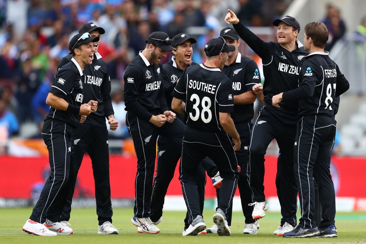 The New Zealand players celebrate after Martin Guptill's direct-hit finds MS Dhoni short, India v New Zealand, World Cup 2019, Old Trafford, July 10, 2019