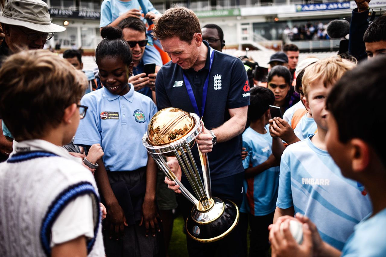 Eoin Morgan gives young fans an opportunity to get up close with the World Cup trophy, The Oval, July 15, 2019