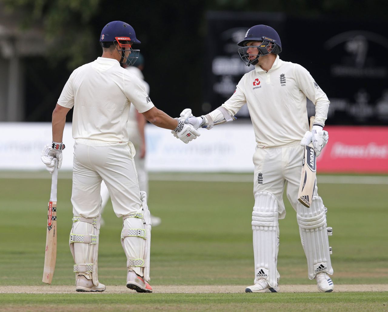 Sam Hain of England Lions is congratulated for his fifty by Sam Curran (right), England Lions v Australians, Tour match, Canterbury, 4th day, July 17, 2019