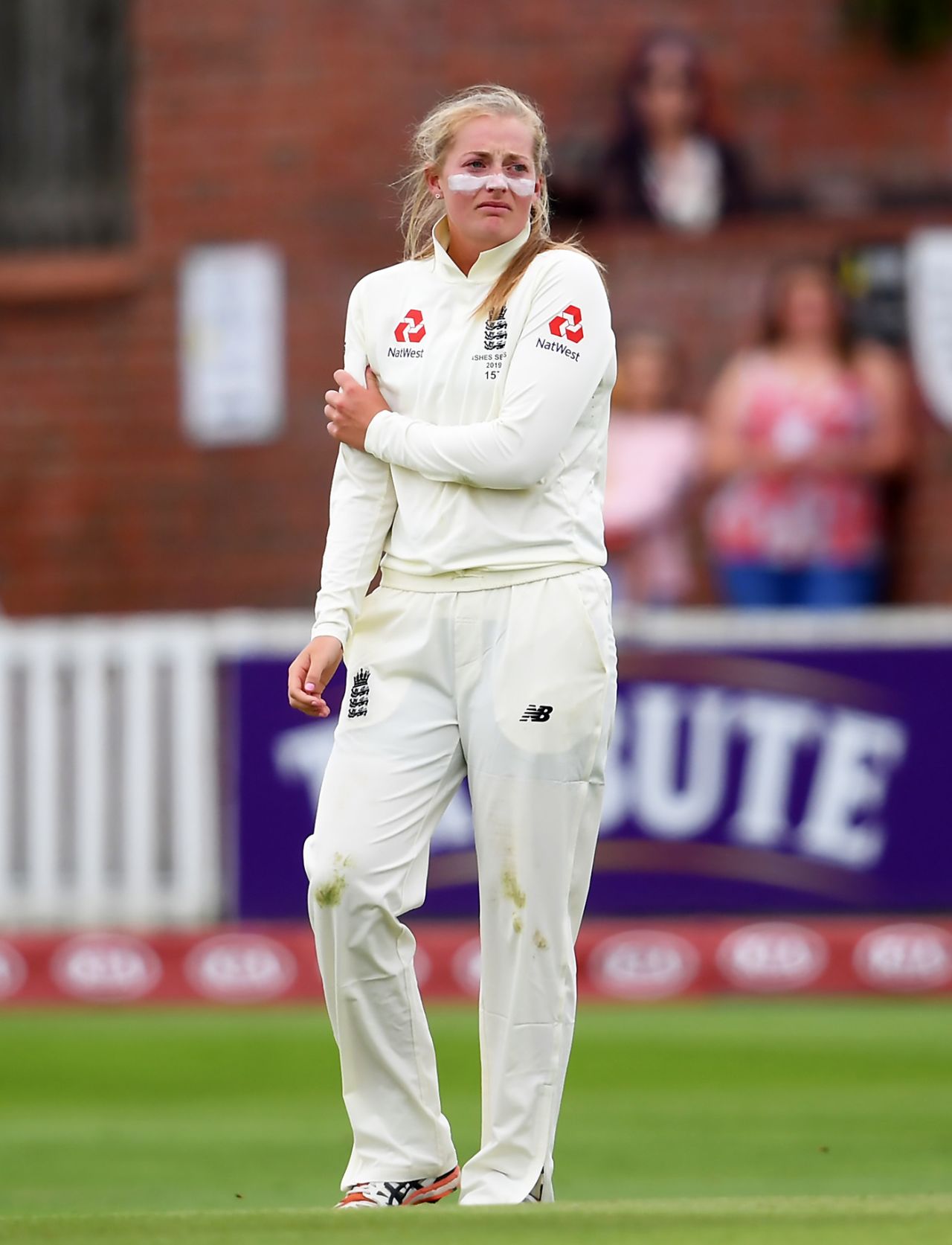 Sophie Ecclestone holds her arm after suffering an injury in the field, England v Australia, Women's Ashes Test, Taunton, 1st day, July 18, 2019