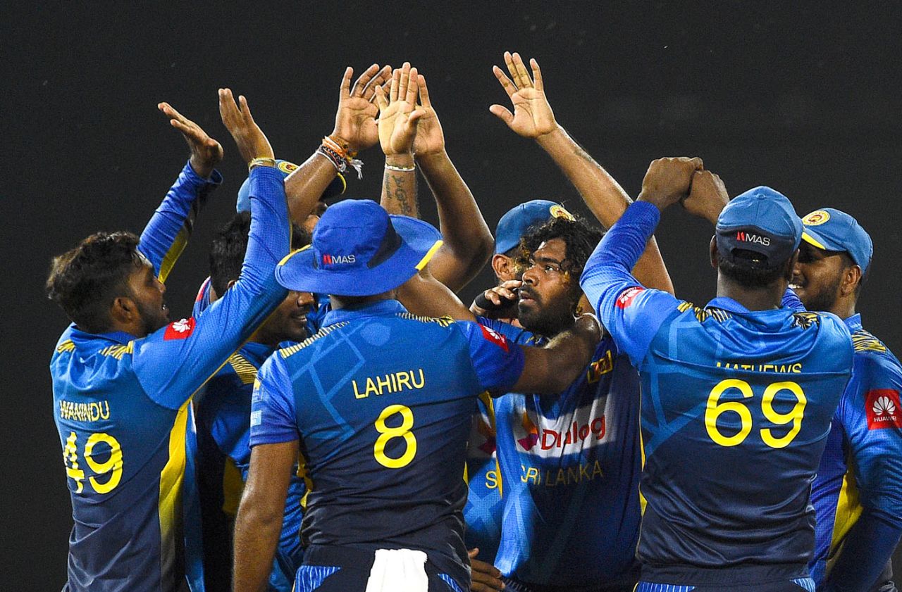 Lasith Malinga is swarmed by his team-mates, Sri Lanka v Bangladesh, 1st ODI, Colombo