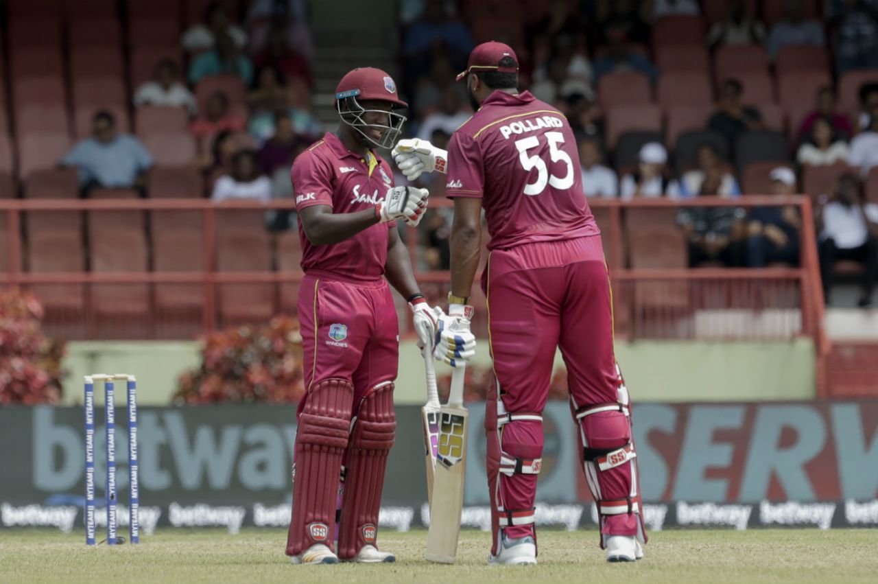 Nicholas Pooran congratulates Kieron Pollard for his half-century, West Indies v India, 3rd T20I, Providence, August 6, 2019