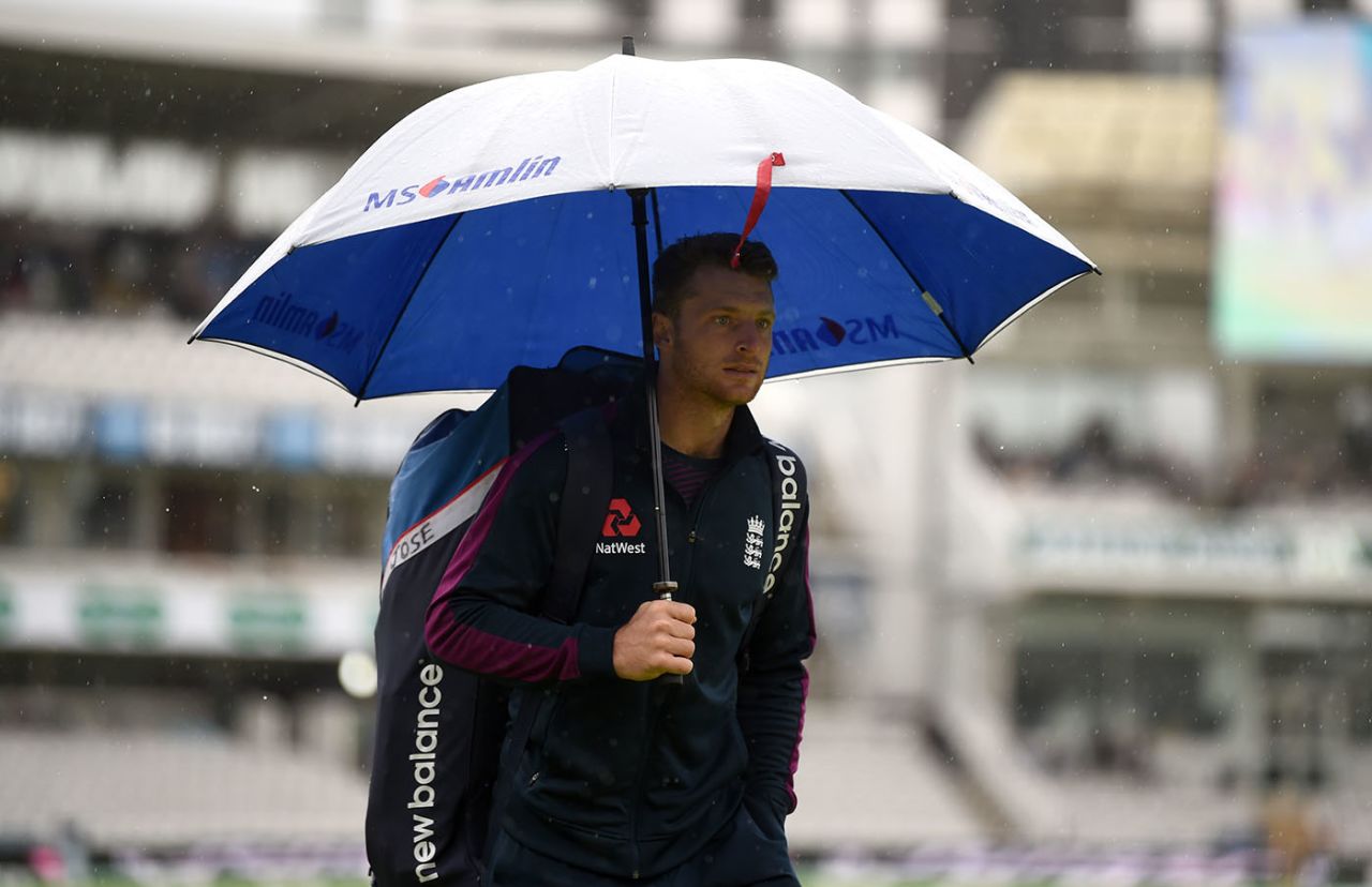 Jos Buttler hides away from the rain at Lord's, England v Australia, 2nd Test, Lord's, August 14, 2019