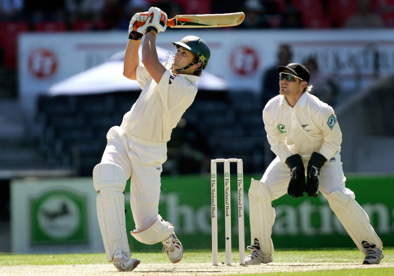 Adam Gilchrist hits Daniel Vettori for six as Brendon McCullum looks on, day three, first Test, Australia tour of New Zealand, Christchurch, March 12, 2005.