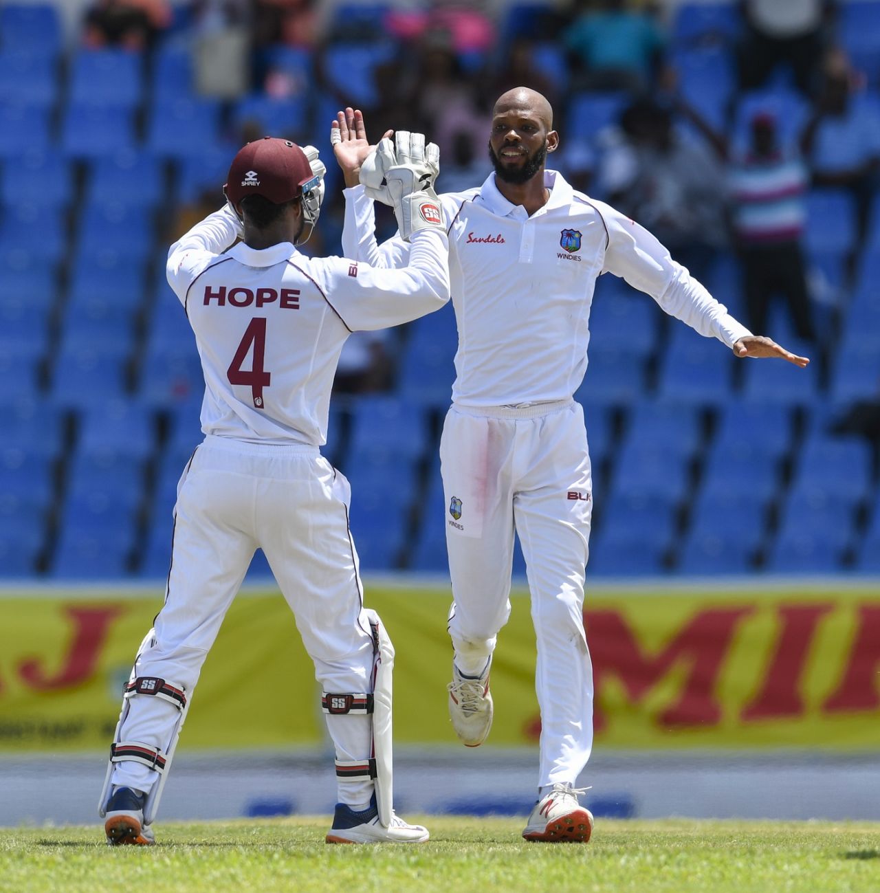 Roston Chase celebrates KL Rahul's dismissal with Shai Hope, West Indies v India, 1st Test, North Sound, 1st day, August 22, 2019