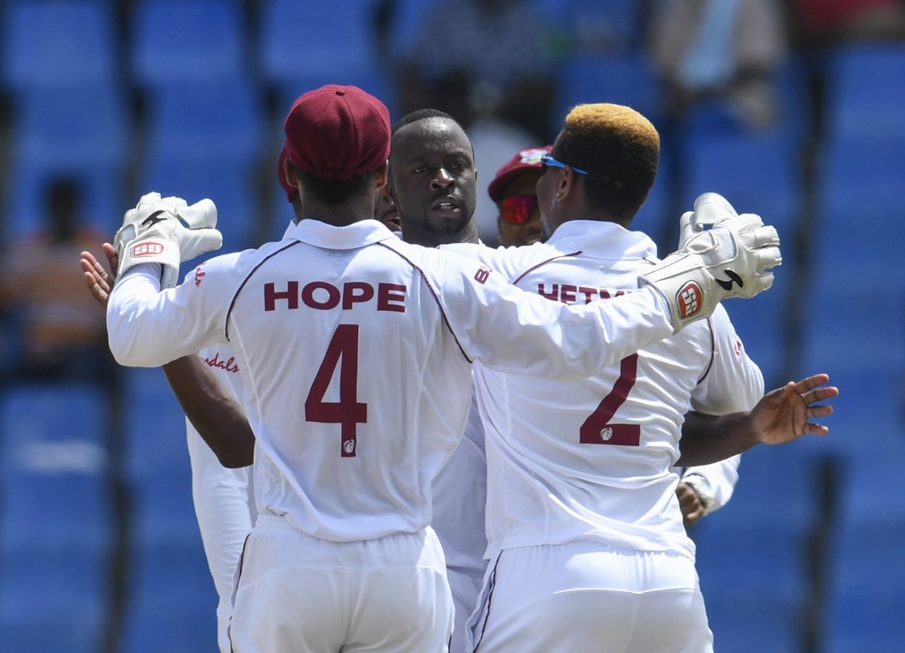 Kemar Roach celebrates the wicket of Cheteshwar Pujara, West Indies v India, 1st Test, North Sound, 3rd day, August 24, 2019