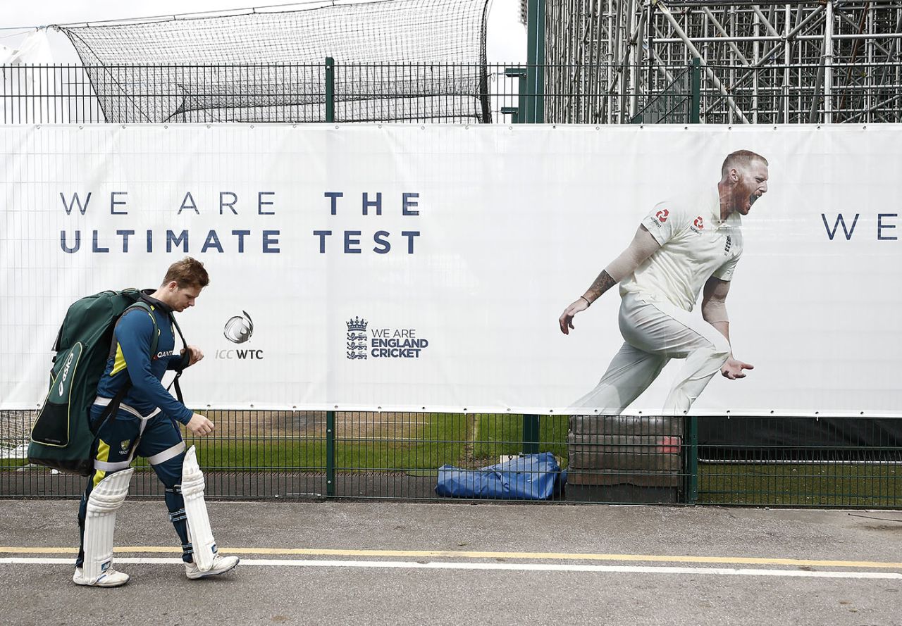 Steve Smith walks back to the changing rooms after a net, ignoring a poster declaring that England represent 'the ultimate test', England v Australia, 4th Test, The Ashes, Old Trafford, September 3, 2019