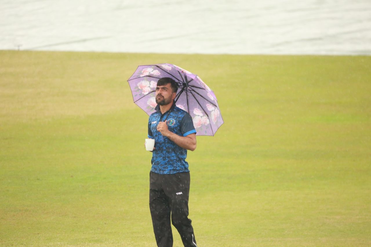 Just four wickets ... Rashid Khan waits for the rain to stop, Bangladesh v Afghanistan, Only Test, Chattogram, 5th day, September 9, 2019