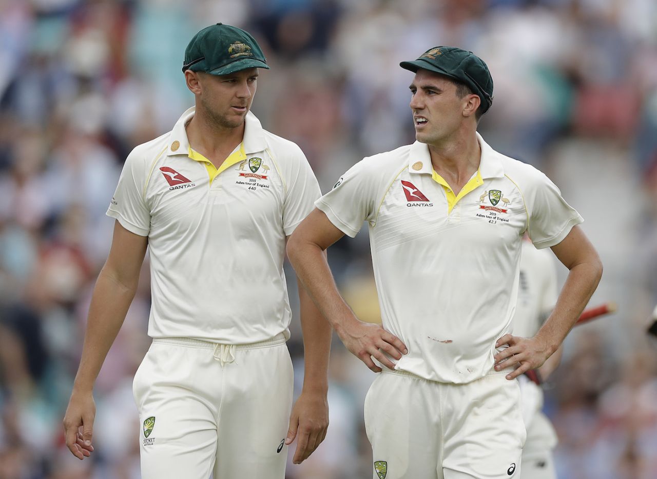 Josh Hazlewood and Pat Cummins of Australia walk from the ground at lunch, day one, 5th Test 2019 Ashes, The Oval, London, England, September 12, 2019