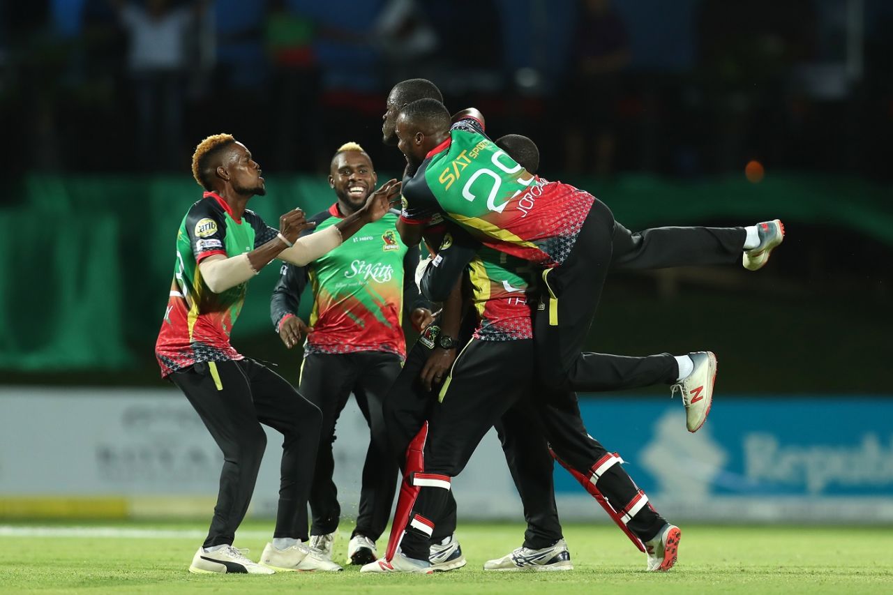 Patriots players mob Carlos Brathwaite after he sealed a win in the Super Over, St Kitts and Nevis Patriots v Trinbago Knight Riders, CPL 2019, Basseterre, September 17, 2019