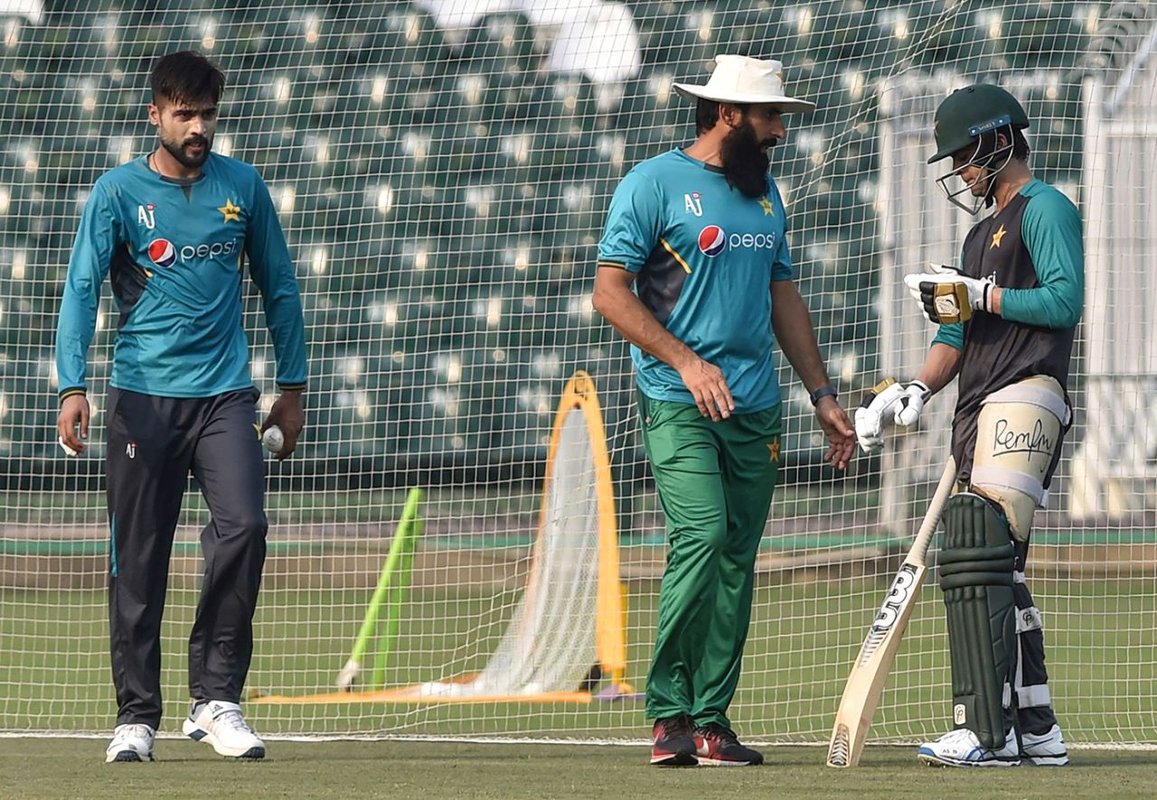 Coach Misbah-ul-Haq chats with Ahmed Shehzad during a training session, Lahore, September 18, 2019