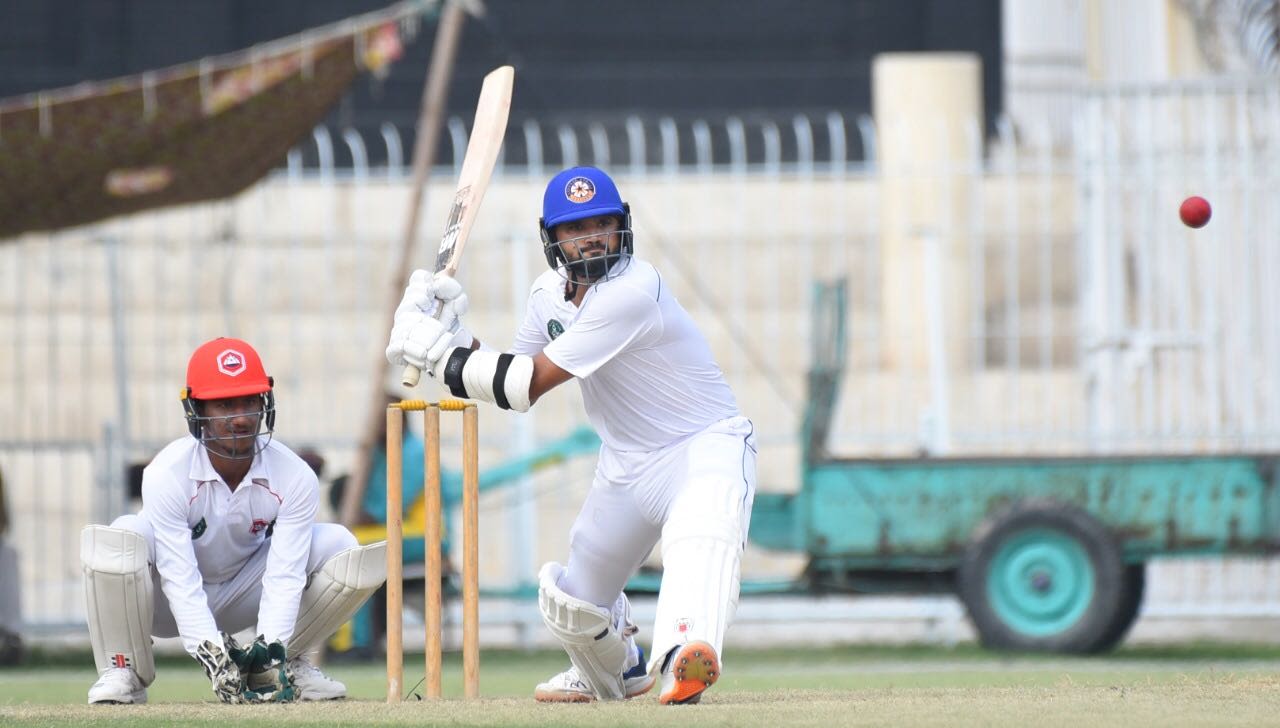 Central Punjab's Azhar Ali gets into position to sweep
