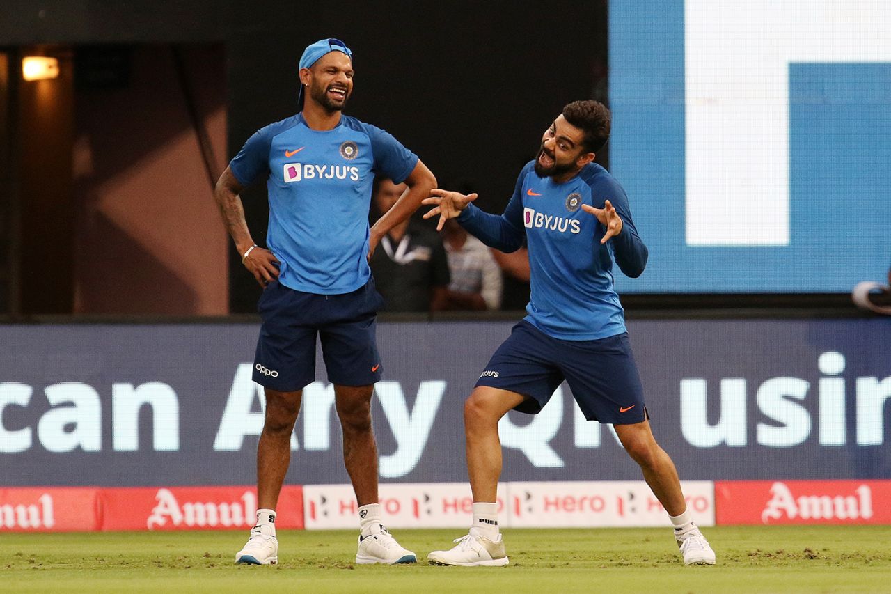 Shikhar Dhawan and Virat Kohli share a light moment, India v South Africa, 3rd T20I, Bengaluru, September 22, 2019