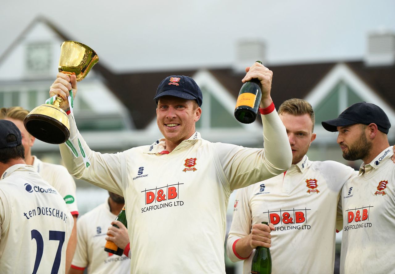 Simon Harmer of Essex celebrates with the County Championship Division One Trophy, Taunton, September 26, 2019