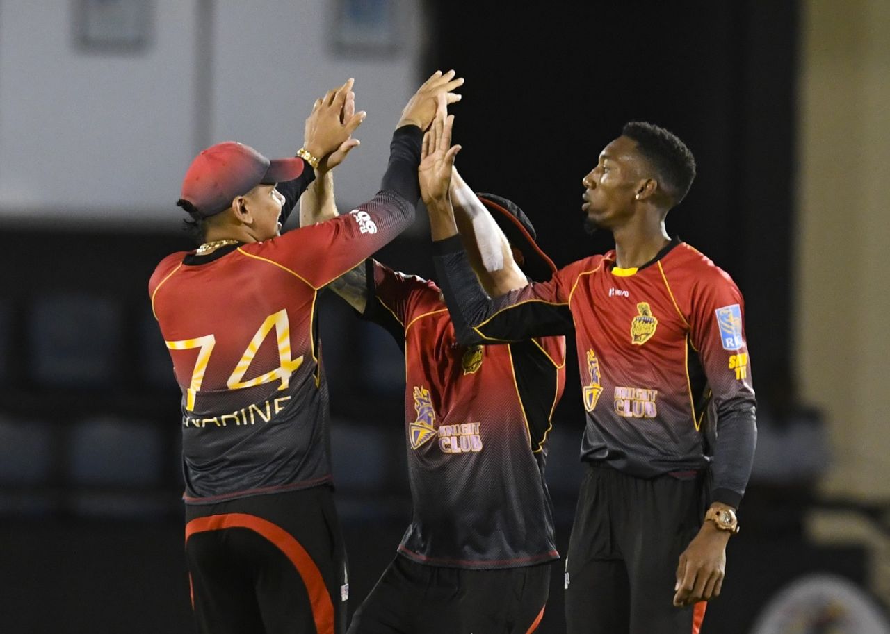 The master and the apprentice: Sunil Narine and Khary Pierre celebrate a wicket