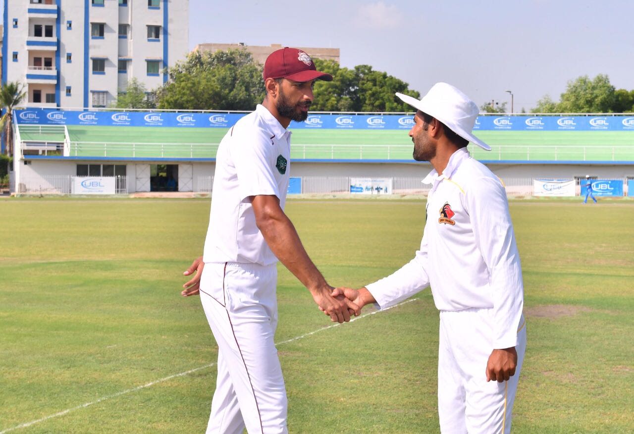 Captains Shan Masood (L) and Asad Shafiq greet each other before the game, Sindh v Southern Punjab, Quaid-e-Azam Trophy 2019-20, 1st day, Karachi, October 5, 2019
