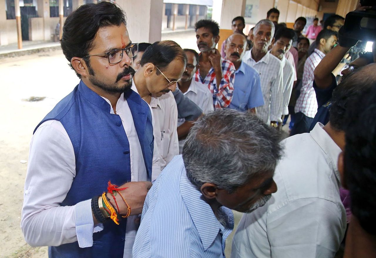 Sreesanth queues with others to cast his vote at a polling station at St. Pious High School, Edappaly in Kochi on May 16, 2016