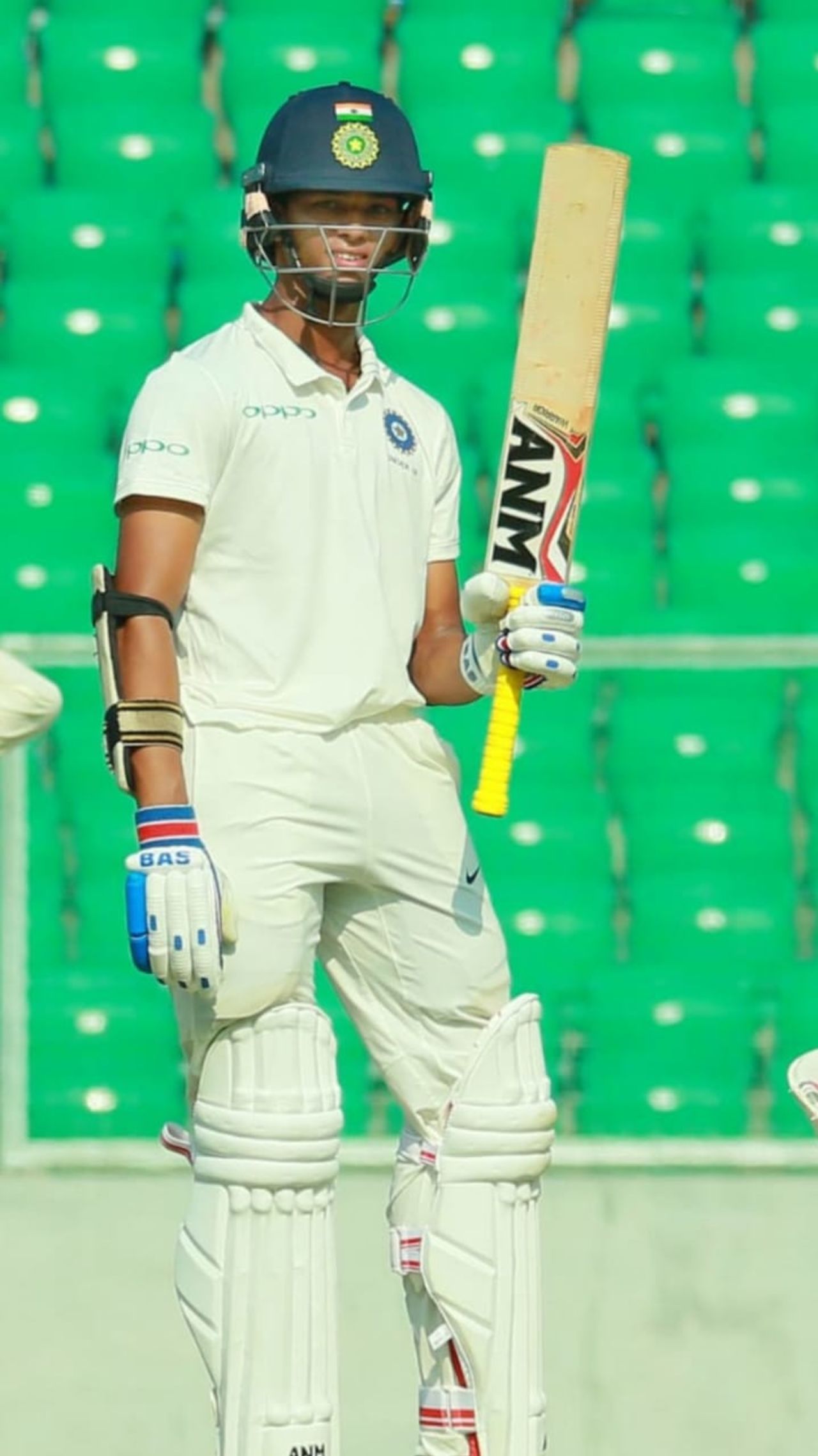 Yashasvi Jaiswal raises his bat to acknowledge another landmark
