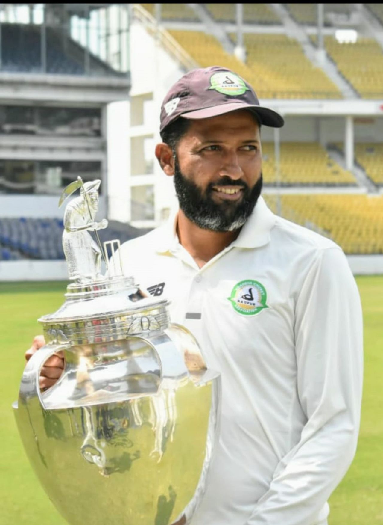Wasim Jaffer poses with the trophy