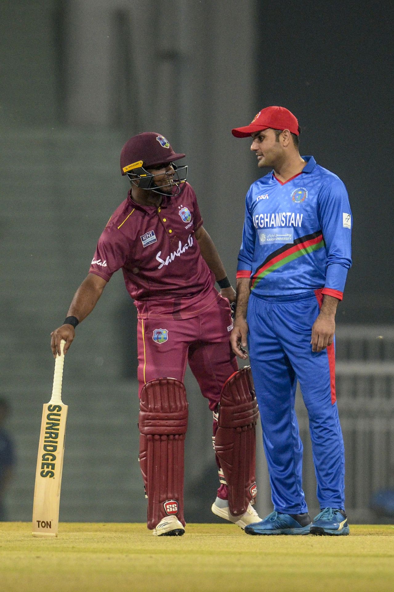 Evin Lewis and Mohammad Nabi have a chat, Afghanistan v West Indies, 1st T20I, Lucknow, November 14, 2019