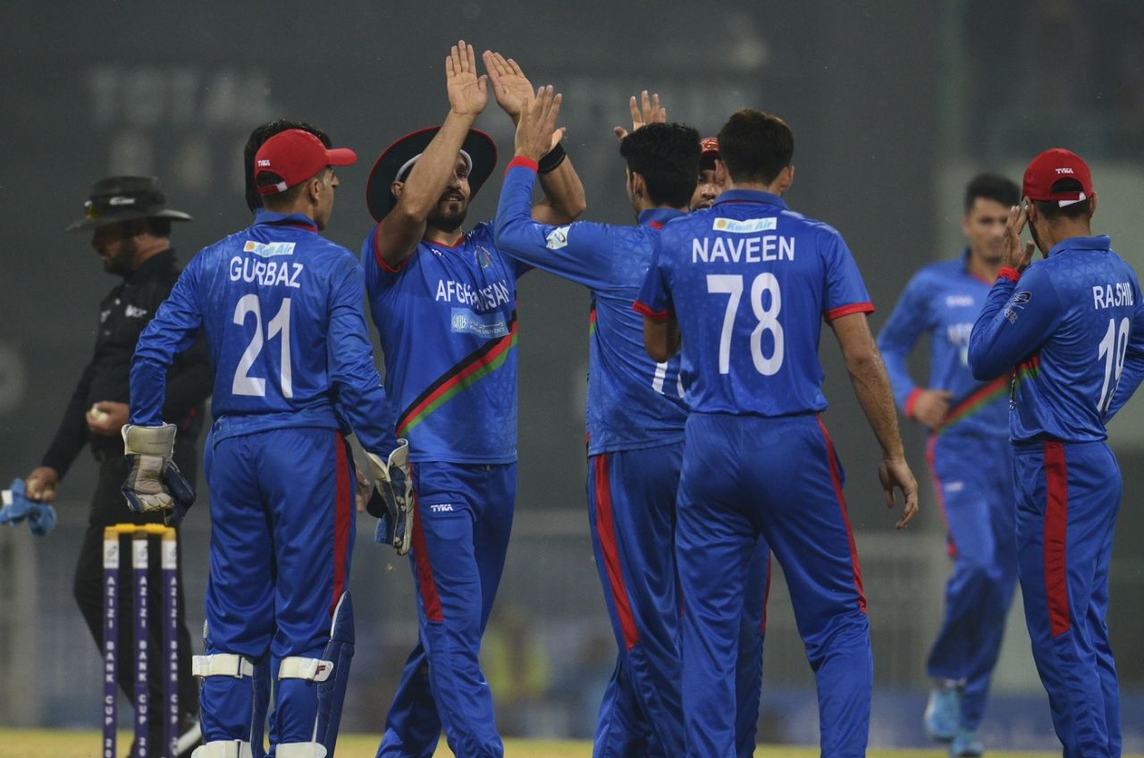 Karim Janat is congratulated for a wicket, Afghanistan v West Indies, 2nd T20I, Lucknow, November 16, 2019