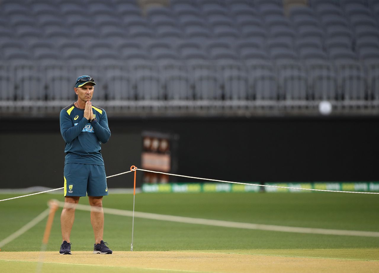 Justin Langer inspects the pitch at Perth Stadium, Perth, December 10, 2019