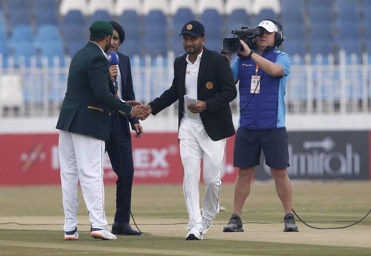 Dimuth Karunaratne shakes hands with Azhar Ali at the toss, Pakistan v Sri Lanka, 1st Test, Rawalpindi, Day 1