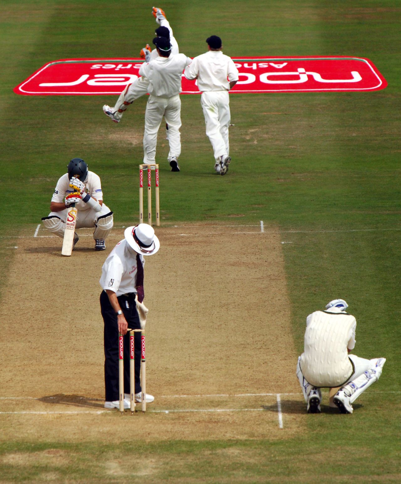 Brett Lee and Michael Kasprowicz sink to their knees after the loss, second Test, England v Australia, Edgbaston, August 7, 2005