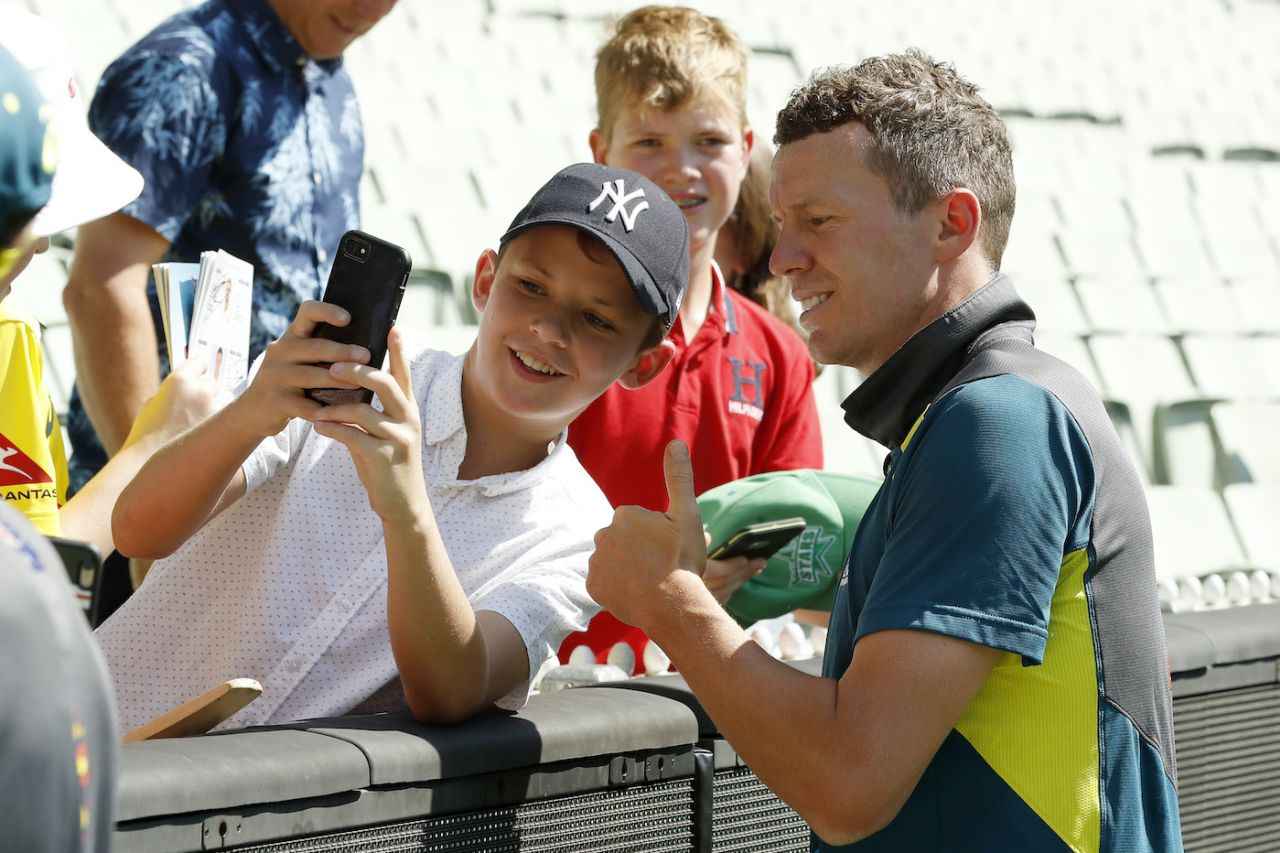 Peter Siddle poses with a fan after retiring from international cricket