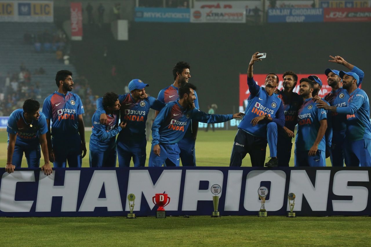 One bunch of Indian players poses for a selfie, while the other waits for the trophy photo, India v Sri Lanka, 3rd T20I, Pune, January 10, 2020