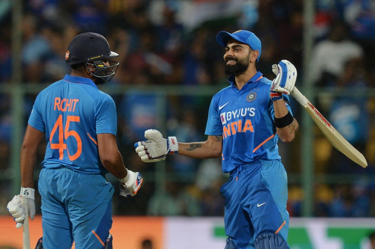 Virat Kohli congratulates Rohit Sharma with a broad grin, India v Australia, 3rd ODI, Bengaluru, January 19, 2020