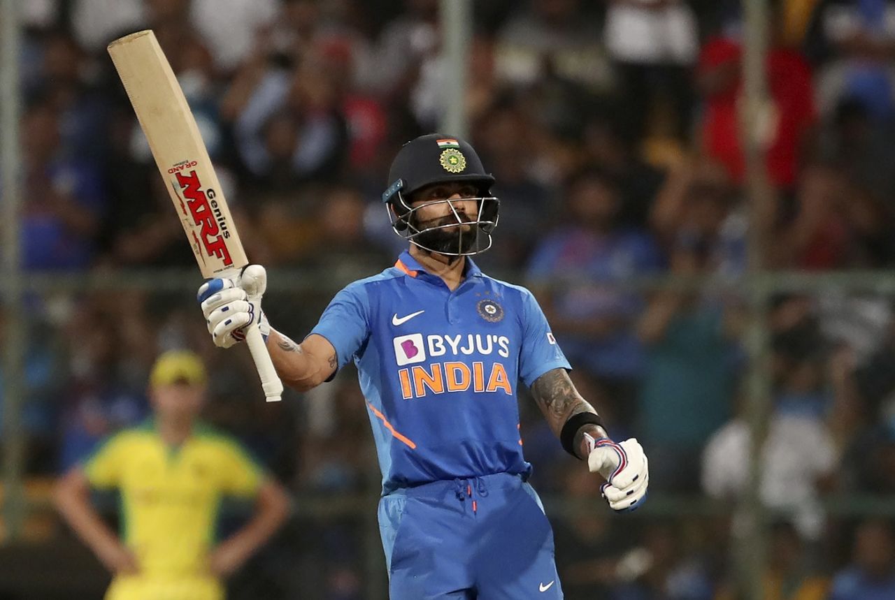 Virat Kohli celebrates a landmark, India v Australia, 3rd ODI, Bengaluru, January 19, 2020