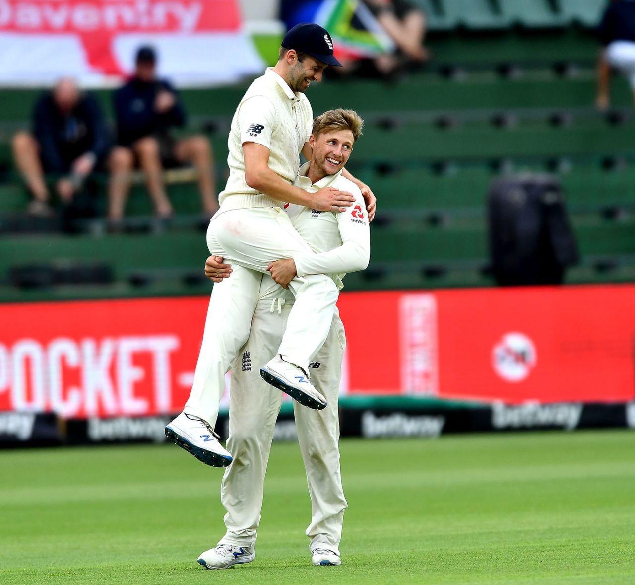 Joe Root and Mark Wood of England celebrate the wicket of Faf du Plessis, South Africa v England, 3rd Test, Port Elizabeth, 4th day, January 19, 2020