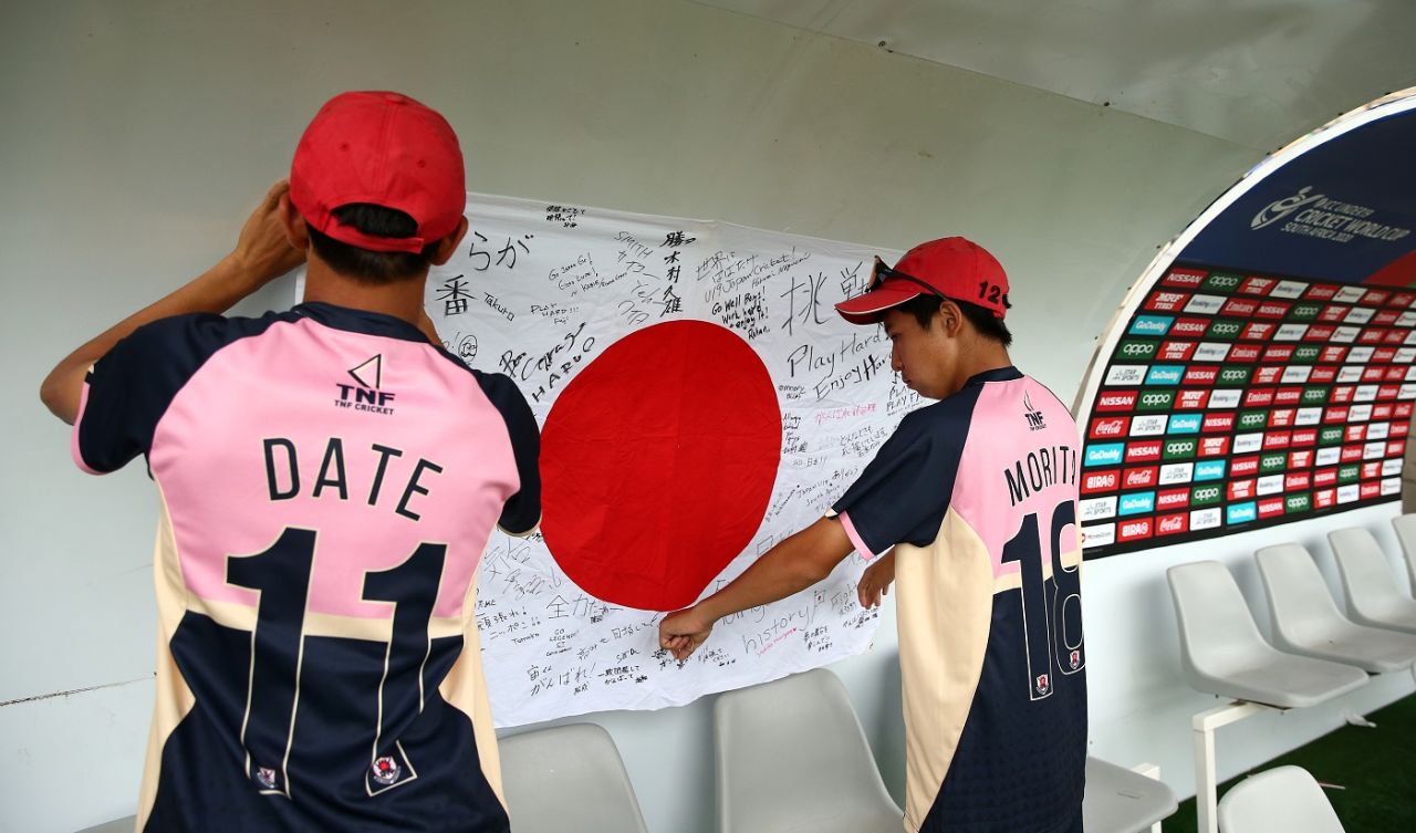 Neel Date and Masato Morita hang up a national flag with personal messages in the dugout, India v Japan, Under-19 World Cup 2020, Bloemfontein, January 21, 2020