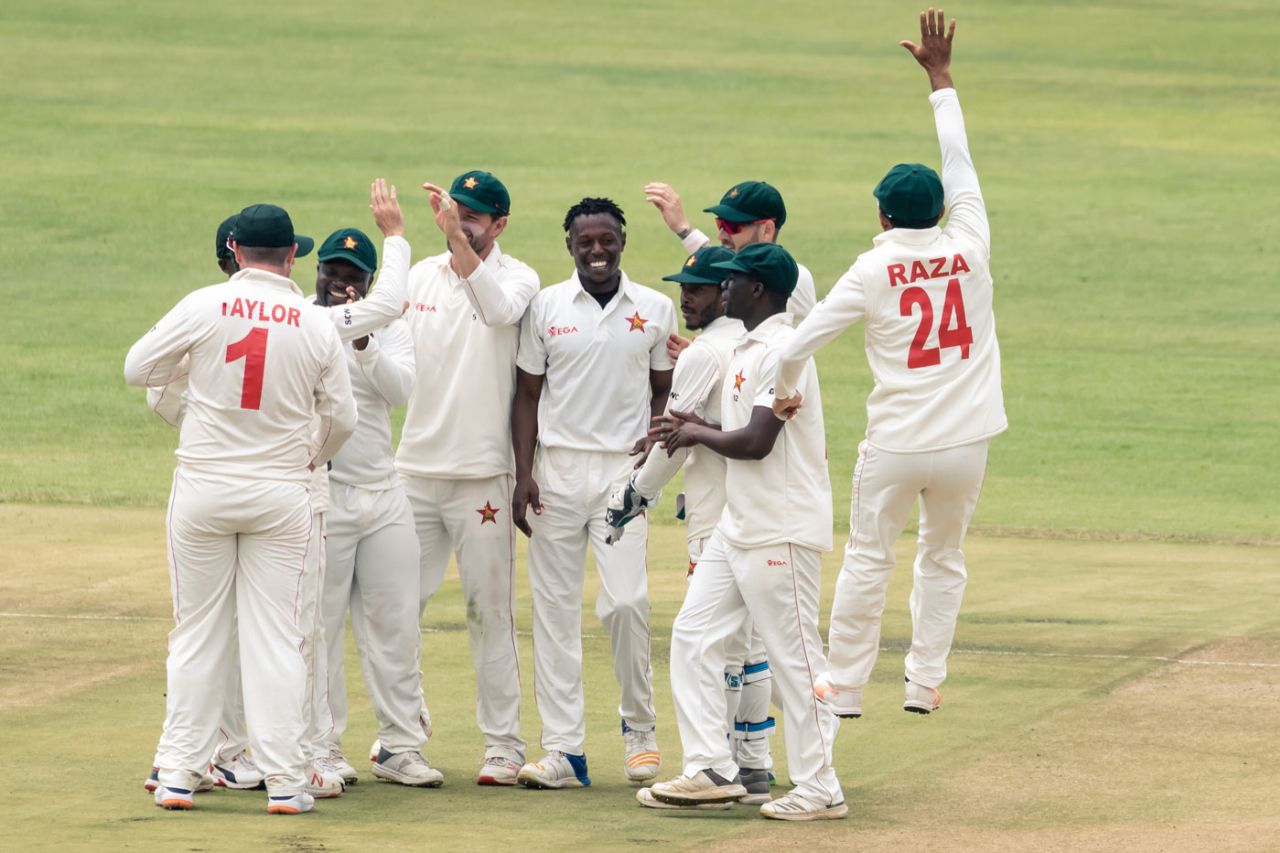 Zimbabwe celebrate around Victor Nyauchi after a wicket, Zimbabwe v Sri Lanka, 1st Test, 3rd Day, Harare, January 21, 2020