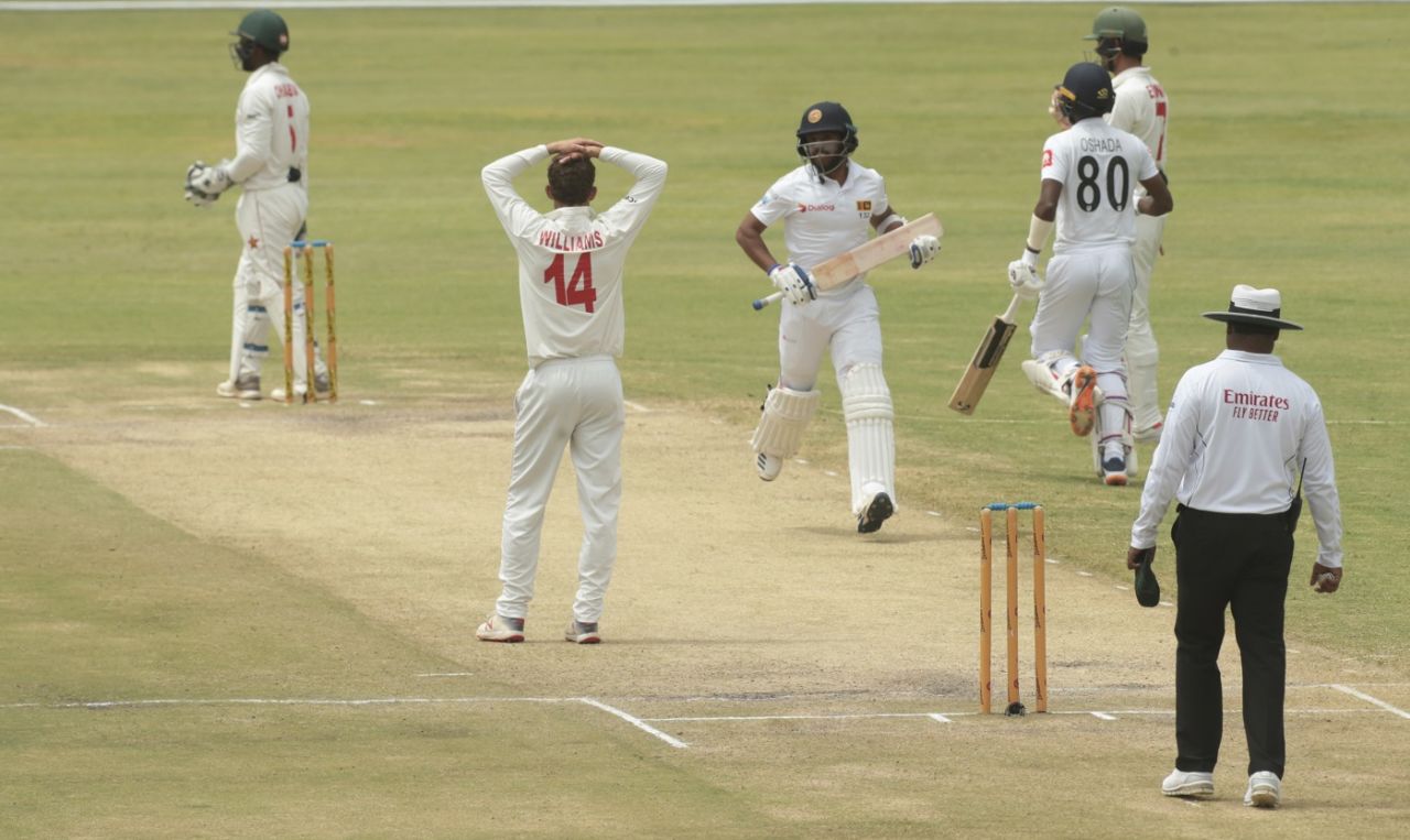 Sean Williams reacts as Kusal Mendis and Oshada Fernando go through for runs, Zimbabwe v Sri Lanka, 2nd Test, Harare, 5th day, January 31, 2020