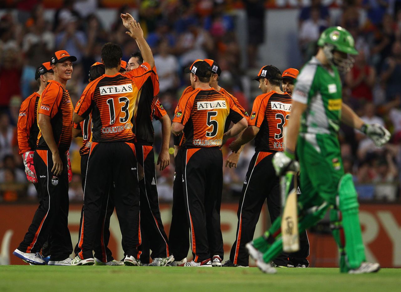 Luke Wright walks off as Perth Scorchers celebrate during the 2011-12 final