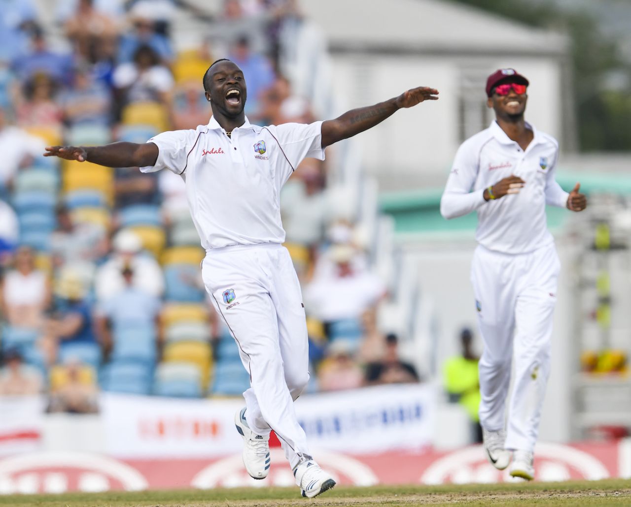 Kemar Roach celebrates the dismissal of Jos Buttler, day 2, first Test, West Indies v England, Kensington Oval, Bridgetown, Barbados, January 24, 2019